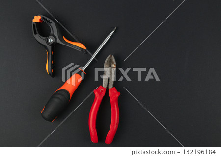 Tools for DIY projects on a black surface Tools for DIY projects on a black surface 132196184