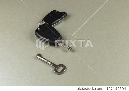 Car keys and a spare key resting on a smooth surface Car keys and a spare key resting on a smooth surface 132196204