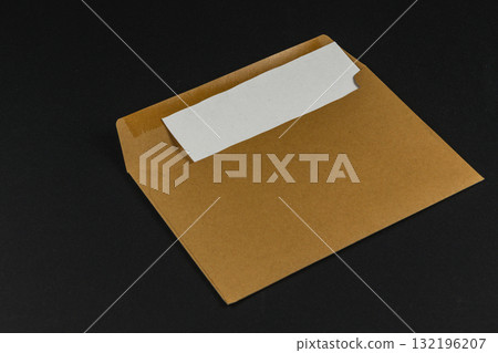 Simple brown envelope on dark surface with blank space for label Simple brown envelope on dark surface with blank space for label 132196207