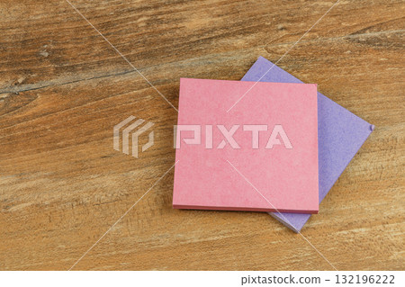 Colorful sticky notes on a wooden desk surface for organizing ideas Colorful sticky notes on a wooden desk surface for organizing ideas 132196222