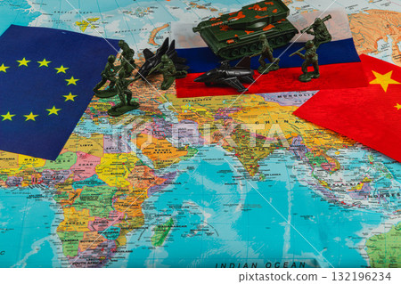 Military figures on a world map highlighting global tensions among nations Military figures on a world map highlighting global tensions among nations 132196234