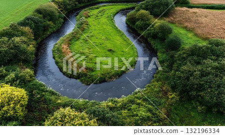 Aerial view of river bends through lush green landscape Aerial view of river bends through lush green landscape 132196334