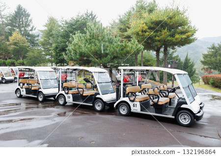 Golf cart parked in the parking lot Golf cart parked in the parking lot 132196864