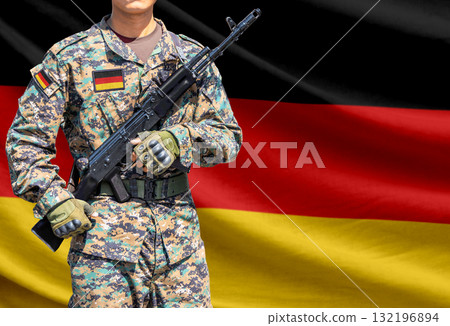 Germany flag with soldier holding assault rifle Germany flag with soldier holding assault rifle 132196894
