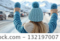 Woman hailing vehicle snowy road winter travel lifestyle image 132197007