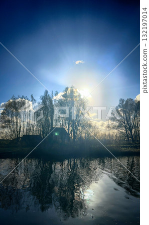 A Stunning Reflection of a Beautiful Sunset Over the Calm Water Creating a Breathtaking Scene A Stunning Reflection of a Beautiful Sunset Over the Calm Water Creating a Breathtaking Scene 132197014