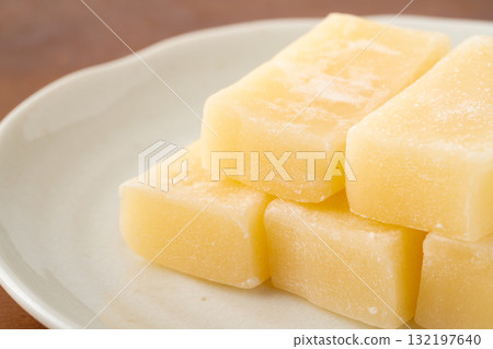 Close-up of butter mochi (a local Akita confectionery) on a plate Close-up of butter mochi (a local Akita confectionery) on a plate 132197640