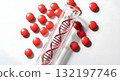 DNA helix model in a test tube with red pills on white background DNA helix model in a test tube with red pills on white background 132197746