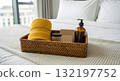 Hotel room amenities on a bed with a view of the city Hotel room amenities on a bed with a view of the city 132197752