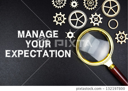 Manage Your Expectations text message with magnifying glass on black background 132197800