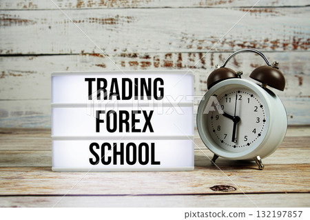 Trading Forex School text with alarm clock on wooden background 132197857