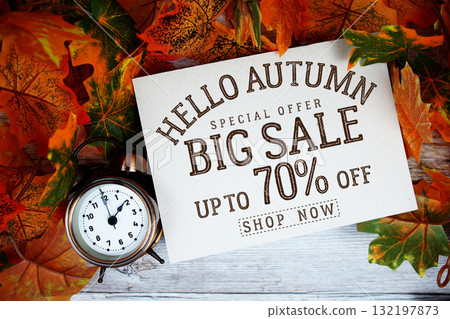Hello Autumn Big Sale 70% off   Special Offer with maple leaf decoration on wooden background 132197873