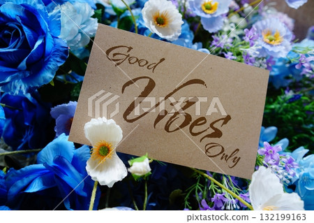 Good vibes only text write on paper card with flowers decoration on wooden background 132199163