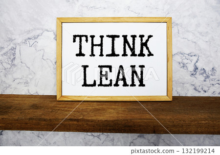 Think Lean text written on whiteboard with wooden shelf and marble background Think Lean text written on whiteboard with wooden shelf and marble background 132199214
