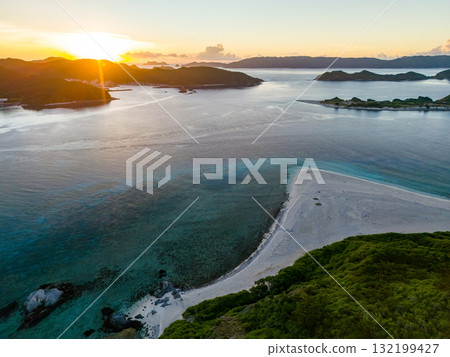 Aerial photography of the sunrise over the Kerama Islands from Zamami Port using a drone. Zamami Port, Zamami Island, Kerama Islands, Shimajiri District, Okinawa Prefecture Aerial photography of the sunrise over the Kerama Islands from Zamami Port using a drone. Zamami Port, Zamami Island, Kerama Islands, Shimajiri District, Okinawa Prefecture 132199427