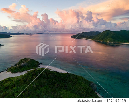 Aerial photography of the sunrise over the Kerama Islands from Zamami Port using a drone. Zamami Port, Zamami Island, Kerama Islands, Shimajiri District, Okinawa Prefecture 132199429