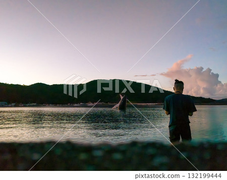 Aerial photography of the sunrise over the Kerama Islands from Zamami Port using a drone. Zamami Port, Zamami Island, Kerama Islands, Shimajiri District, Okinawa Prefecture 132199444