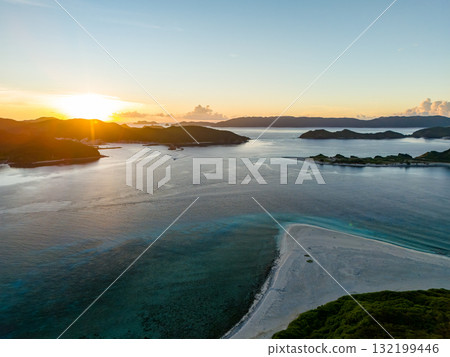 Aerial photography of the sunrise over the Kerama Islands from Zamami Port using a drone. Zamami Port, Zamami Island, Kerama Islands, Shimajiri District, Okinawa Prefecture Aerial photography of the sunrise over the Kerama Islands from Zamami Port using a drone. Zamami Port, Zamami Island, Kerama Islands, Shimajiri District, Okinawa Prefecture 132199446