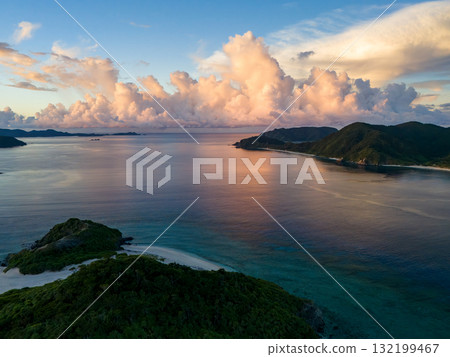 Aerial photography of the sunrise over the Kerama Islands from Zamami Port using a drone. Zamami Port, Zamami Island, Kerama Islands, Shimajiri District, Okinawa Prefecture 132199467