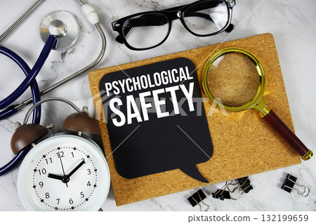 Psychological Safety text with Stethoscope, alarm clock and magnifying glass on marble background Psychological Safety text with Stethoscope, alarm clock and magnifying glass on marble background 132199659