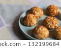Traditional Catalan pine nut sweets panellets on a pastel plate 132199684