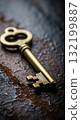 Vintage brass key on a rustic wooden surface, close-up shot Vintage brass key on a rustic wooden surface, close-up shot 132199887