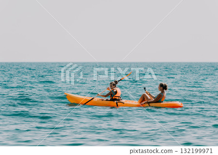 Two Women Kayaking on a Sunny Day Two Women Kayaking on a Sunny Day 132199971