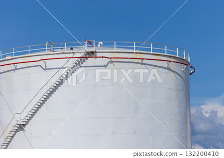 White crude oil storage tanks at petroleum refinery industrial plant, Fuel gas containers in factory area, Energy industry infrastructure, Oil and Gas storage tank blue sky background. 132200410