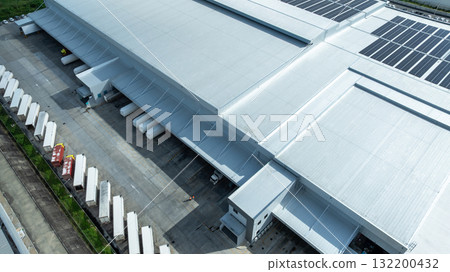 Aerial view modern warehouse for trucks unloading and loading, semi truck cargo trailer at logistic park warehouse, Distribution warehouse shipping supply chain, Business transportation logistic. 132200432