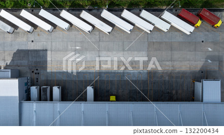 Aerial view modern warehouse for trucks unloading and loading, semi truck cargo trailer at logistic park warehouse, Distribution warehouse shipping supply chain, Business transportation logistic. 132200434