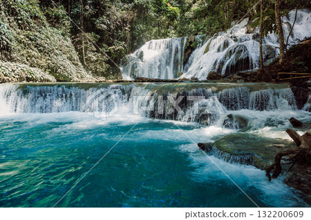 Cascade waterfall with blue water in jungle, 132200609
