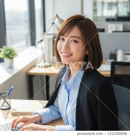 Young Japanese woman doing desk work in the office Young Japanese woman doing desk work in the office 132200898