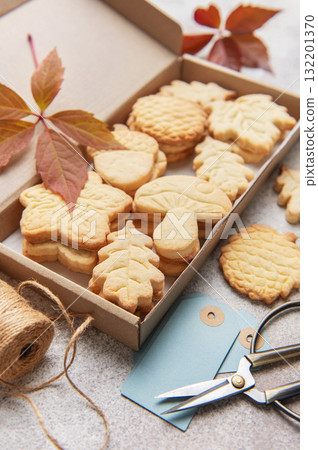 Autumn shaped cookies baking in cardboard gift box Autumn shaped cookies baking in cardboard gift box 132201370