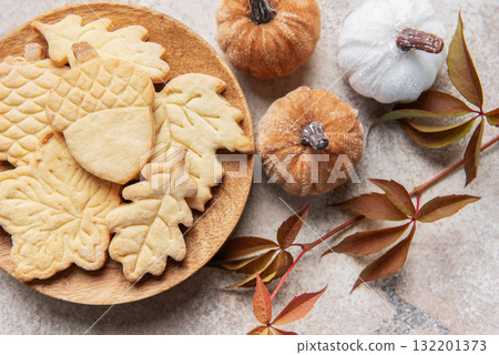 Autumn leaf and acorn cookies with festive pumpkins 132201373