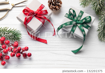 Christmas gifts wrapping on white wooden background Christmas gifts wrapping on white wooden background 132201375