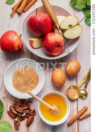 Baking ingredients for apple dessert on wooden table 132201380