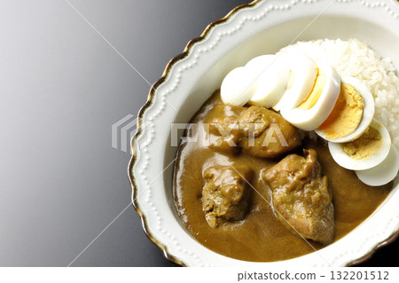 Chicken curry with boiled egg on a black background 132201512