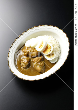 Chicken curry with boiled egg on a black background 132201514