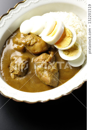 Chicken curry with boiled egg on a black background 132201519