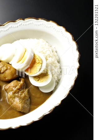 Chicken curry with boiled egg on a black background 132201521
