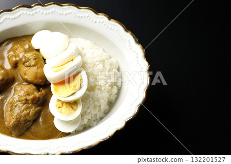 Chicken curry with boiled egg on a black background 132201527