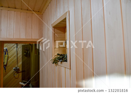 Interior of a traditional steam bath (sauna) with a wood-burning stove Interior of a traditional steam bath (sauna) with a wood-burning stove 132201816