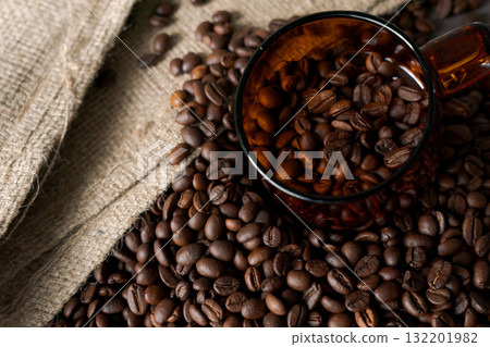 Burlap sack and roasted coffee beans 132201982