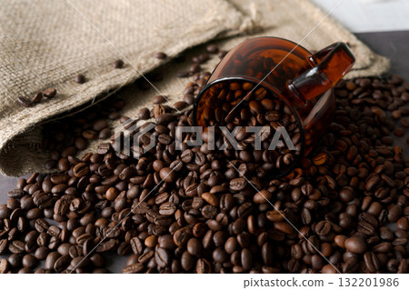 Burlap sack and roasted coffee beans 132201986