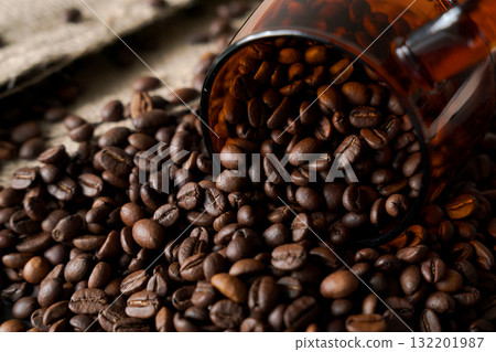 Burlap sack and roasted coffee beans 132201987