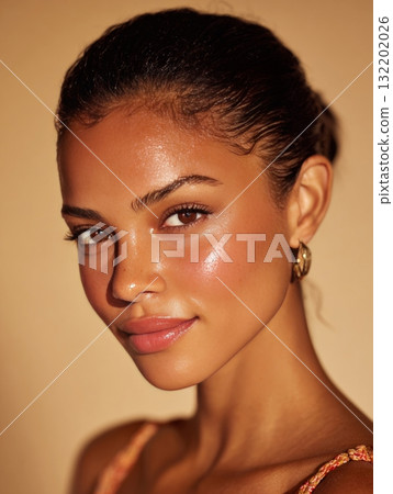 Woman featuring glowy skin with a natural dewy makeup look Woman featuring glowy skin with a natural dewy makeup look 132202026