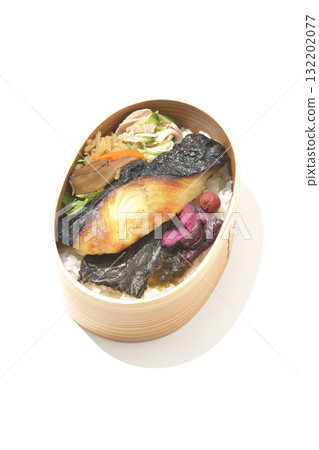 A bento lunch box with seaweed and grilled silver cod served in a bento box, photographed against a white background 132202077