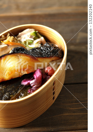 A bento lunch box with seaweed and grilled silver cod in a bento box. 132202140