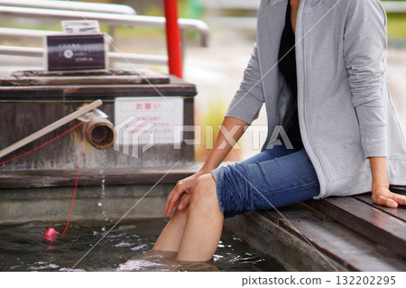 A woman bathing in a foot bath at the Oyasukyo General Information Center A woman bathing in a foot bath at the Oyasukyo General Information Center 132202295