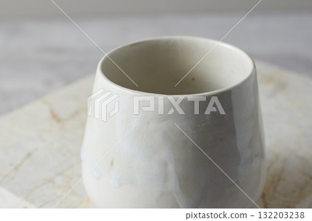 Close up ceramic cup on gray background 132203238